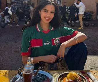 Moroccan lady cooking her Tagine